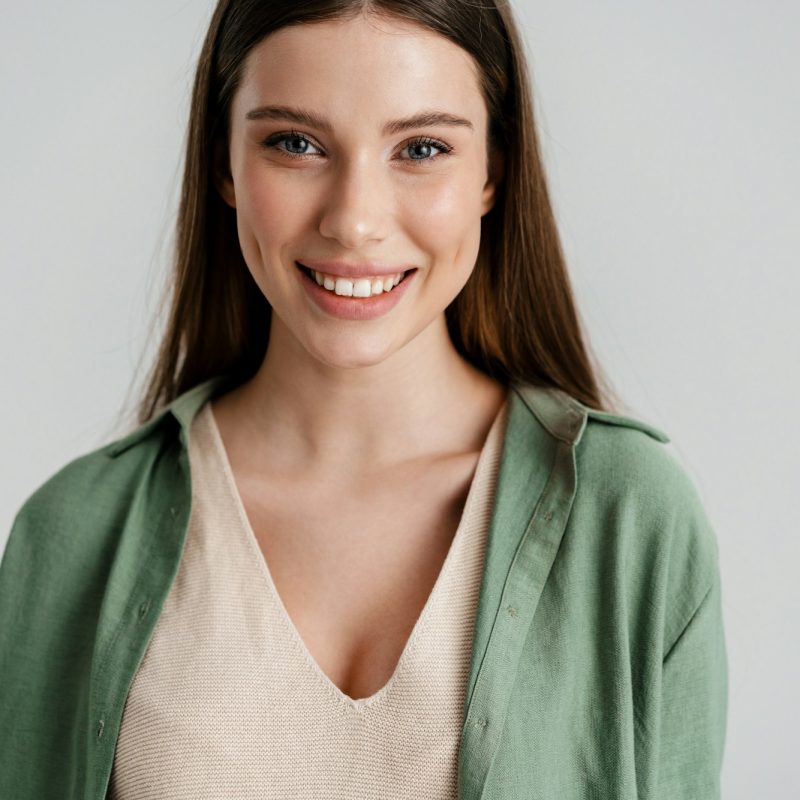 Happy caucasian girl smiling and looking at camera